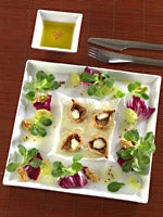 Feigen mit geschmolzenem Ziegenkäse und Blattsalat